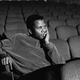 Sidney Poitier sits in an empty theater